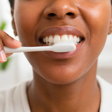 Brushing teeth after applying Mouth OS toothpaste film as part of a normal oral care routine