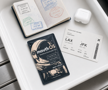 Mouth OS Mint Frost sealed Precision Dose in a travel tray with passport and boarding pass, TSA-friendly oral care